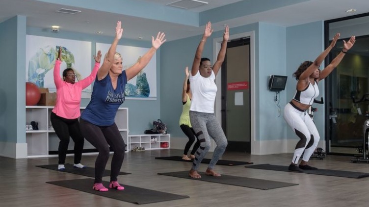 Residents participating in a group fitness class