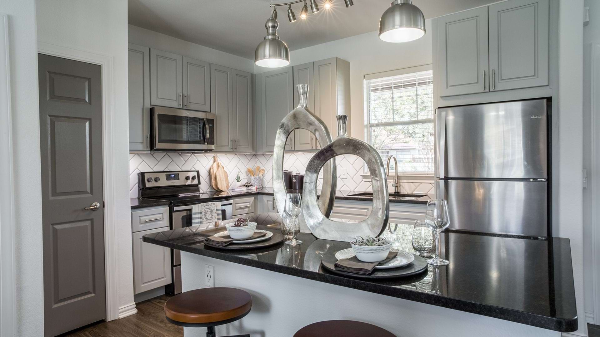 Modern apartment kitchen with stainless steel appliances
