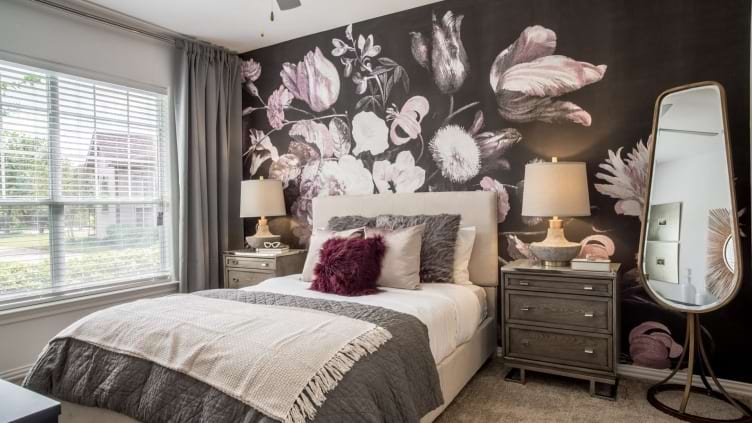 Bedroom with decorative accent wall